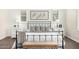 The main bedroom boasts stylish nightstands and natural light from the plantation shutters at 27562 N 99Th Dr, Peoria, AZ 85383