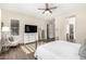 Main bedroom features a white dresser, area rug, and private ensuite at 27562 N 99Th Dr, Peoria, AZ 85383