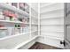 Spacious walk-in pantry with floor-to-ceiling shelving and ample storage space at 27562 N 99Th Dr, Peoria, AZ 85383