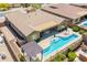 Aerial view of a backyard pool and patio area, perfect for outdoor living at 27562 N 99Th Dr, Peoria, AZ 85383