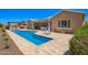 Wide shot of the pool area, with outdoor seating and a pergola, perfect for entertaining guests at 27562 N 99Th Dr, Peoria, AZ 85383