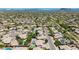 Scenic aerial view of homes nestled in a desert landscape with swimming pools and mature trees at 29816 N 51St Pl, Cave Creek, AZ 85331