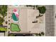 Overhead view of a property with a manicured lawn, pool, outdoor seating, and a desert landscape at 29816 N 51St Pl, Cave Creek, AZ 85331