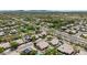 Expansive aerial view showcasing a desert community with many homes, several pools, and mountain views at 29816 N 51St Pl, Cave Creek, AZ 85331
