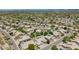 Wide aerial view of a desert community featuring beautiful homes, community parks, and scenic mountain views at 29816 N 51St Pl, Cave Creek, AZ 85331