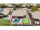 Aerial view of house with pool, patio, putting green, and well-maintained landscaping at 29816 N 51St Pl, Cave Creek, AZ 85331