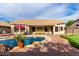 Enjoy a refreshing swim in the pool of this backyard with a covered patio perfect for relaxation at 29816 N 51St Pl, Cave Creek, AZ 85331