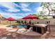 Backyard oasis features pool, spa, and relaxing seating area for enjoying outdoor leisure and entertaining at 29816 N 51St Pl, Cave Creek, AZ 85331