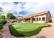 Backyard putting green, pool, patio and exterior view at 29816 N 51St Pl, Cave Creek, AZ 85331