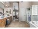 Bathroom with double vanity, jacuzzi tub and glass shower at 29816 N 51St Pl, Cave Creek, AZ 85331