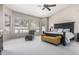 Spacious bedroom featuring a large bed, comfortable seating, and bright natural light from multiple windows at 29816 N 51St Pl, Cave Creek, AZ 85331