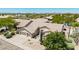 Beautiful home exterior with a well-kept yard, three-car garage, desert landscaping, and a welcoming entrance at 29816 N 51St Pl, Cave Creek, AZ 85331