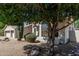 Charming single-story home featuring desert landscaping with mature trees and a saguaro cactus at 29816 N 51St Pl, Cave Creek, AZ 85331