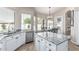 Open kitchen featuring granite counters, stainless appliances, breakfast bar, and adjacent dining area at 29816 N 51St Pl, Cave Creek, AZ 85331