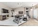 Open-concept living area with fireplace, plush seating, tall ceilings and neutral color scheme at 29816 N 51St Pl, Cave Creek, AZ 85331