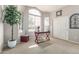 Home office with ample natural light, a modern desk, and decorative tree at 29816 N 51St Pl, Cave Creek, AZ 85331