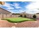 Backyard putting green is surrounded by desert landscaping and features mature trees and a putting green at 29816 N 51St Pl, Cave Creek, AZ 85331