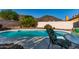 A beautiful backyard pool with desert landscaping and mountain views, offering a private oasis at 3018 W Country Club Ter, Phoenix, AZ 85027