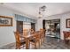 Bright dining room features a chandelier and sliding glass doors to the backyard patio at 3018 W Country Club Ter, Phoenix, AZ 85027