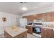 Efficient kitchen design with stainless steel appliances, a refrigerator, and ample cabinet space at 3018 W Country Club Ter, Phoenix, AZ 85027