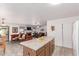 Open concept kitchen featuring stainless steel appliances and a view into the cozy living room at 3018 W Country Club Ter, Phoenix, AZ 85027