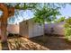Backyard shed offers ample storage and blends into the desert landscape at 3018 W Country Club Ter, Phoenix, AZ 85027