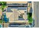 Aerial view showcasing a home with a private pool, well-maintained landscaping, and a courtyard at 3038 E Longhorn Dr, Gilbert, AZ 85297