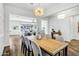 Elegant dining area with a stylish light fixture and seamless transition to the living room at 3038 E Longhorn Dr, Gilbert, AZ 85297