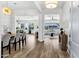 Inviting foyer with wood floors leading to open-concept living spaces and designer lighting at 3038 E Longhorn Dr, Gilbert, AZ 85297