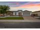 Stunning single-story home with stone accents, a paver driveway, and a lush front lawn at 3038 E Longhorn Dr, Gilbert, AZ 85297