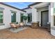 Charming front courtyard with a seating area, paver flooring, and stylish exterior finishes at 3038 E Longhorn Dr, Gilbert, AZ 85297