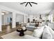 Open living space showcasing a comfortable sofa and seamless access to the dining and kitchen areas at 3038 E Longhorn Dr, Gilbert, AZ 85297