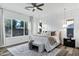 Bright main bedroom with stylish decor, wood floors, large window, and decorative paneled accent wall at 3038 E Longhorn Dr, Gilbert, AZ 85297