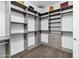 Custom walk-in closet with built-in shelving, drawers, and storage solutions for optimal organization at 3038 E Longhorn Dr, Gilbert, AZ 85297