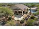 Aerial view of home showcasing a serene backyard with a pool, mature landscaping, and privacy fence at 34611 N Sunset Trl, Cave Creek, AZ 85331