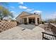 Desert home featuring a covered patio and stone-paved backyard, perfect for outdoor living at 34611 N Sunset Trl, Cave Creek, AZ 85331