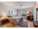 Comfortable bedroom with a large window, hardwood floors, and ample natural light at 34611 N Sunset Trl, Cave Creek, AZ 85331