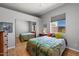 Cozy bedroom with a mirrored closet and bright window at 34611 N Sunset Trl, Cave Creek, AZ 85331