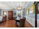 Formal dining room with decorative ceiling, large window, and comfortable seating for Gathering gatherings and entertaining at 34611 N Sunset Trl, Cave Creek, AZ 85331