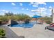 Private pool with custom stone surround and serene desert views at 34611 N Sunset Trl, Cave Creek, AZ 85331