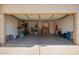 Spacious garage with ample storage and organization, providing convenient parking and room for projects at 36179 W Cartegna Ln, Maricopa, AZ 85138