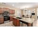 Kitchen featuring stainless steel appliances and a center island at 36179 W Cartegna Ln, Maricopa, AZ 85138