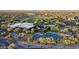 Aerial view of the community clubhouse, pool, and tennis courts, highlighting the neighborhood's amenities at 3817 E Patrick Ln, Phoenix, AZ 85050
