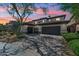 Beautiful home featuring a multi-car garage, desert landscaping, and a charming exterior design at 3817 E Patrick Ln, Phoenix, AZ 85050