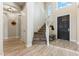 Welcoming foyer with soaring ceilings, tile floors, and a staircase leading to the second floor at 3817 E Patrick Ln, Phoenix, AZ 85050