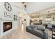 Open-concept living room with a cozy fireplace, soaring ceilings, and elegant tile flooring at 3817 E Patrick Ln, Phoenix, AZ 85050