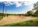 Well maintained sand volleyball court surrounded by lush green grass perfect for recreational play at 3817 E Patrick Ln, Phoenix, AZ 85050