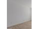 Bright bedroom with clean white walls and neutral tile floors at 40595 W Michaels Dr, Maricopa, AZ 85138