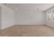 Large open living room with recessed lighting, tile flooring, and natural light at 40595 W Michaels Dr, Maricopa, AZ 85138