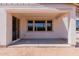 Covered patio with sliding door, concrete floor, and view to backyard at 40595 W Michaels Dr, Maricopa, AZ 85138